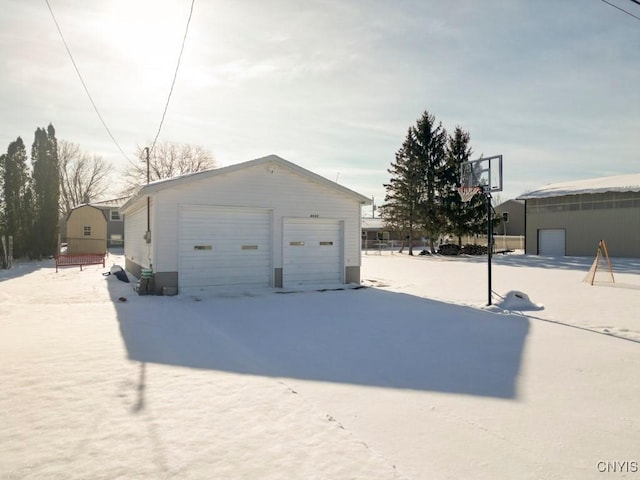 view of snow covered garage