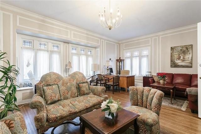 living room featuring hardwood / wood-style flooring, plenty of natural light, and a chandelier