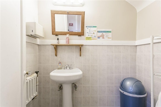 bathroom with tile walls