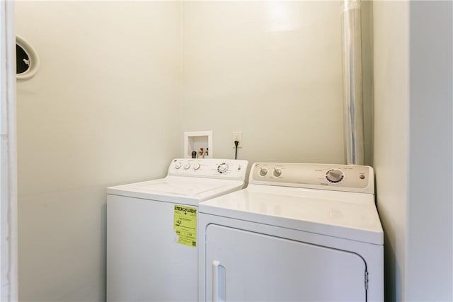 laundry area with independent washer and dryer