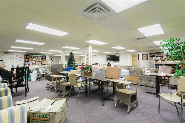 misc room with carpet and a drop ceiling