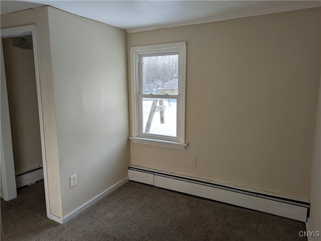 carpeted spare room with baseboard heating