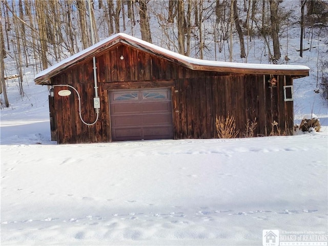 view of snow covered garage