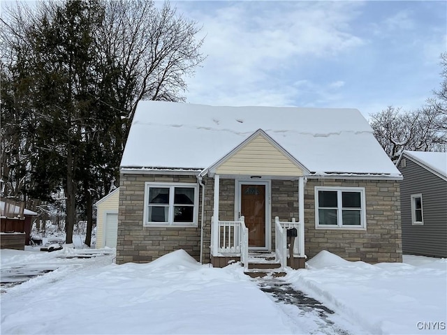 view of front of home featuring a garage and an outdoor structure