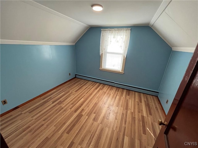 bonus room featuring hardwood / wood-style flooring, baseboard heating, and vaulted ceiling