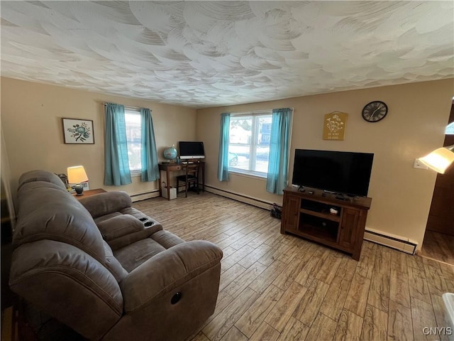 living room featuring a textured ceiling, a baseboard radiator, and hardwood / wood-style flooring