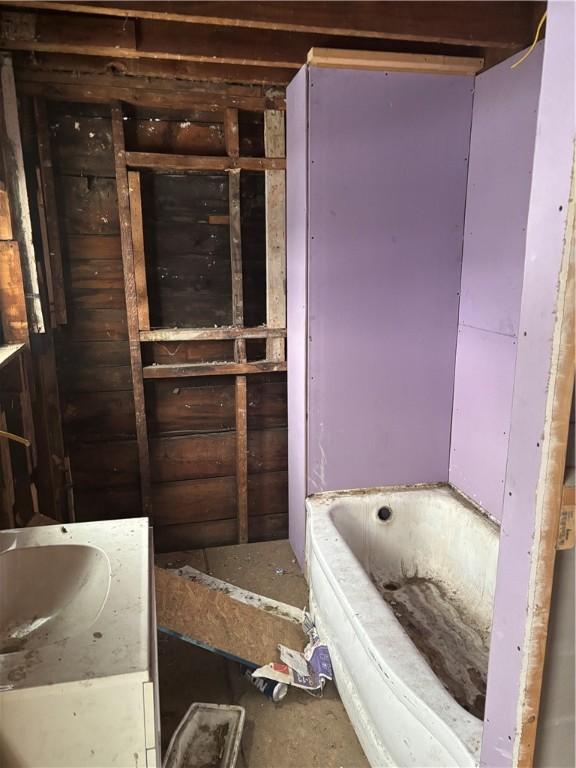 bathroom with a washtub