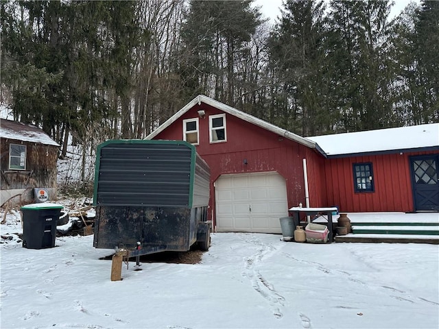 view of snow covered garage