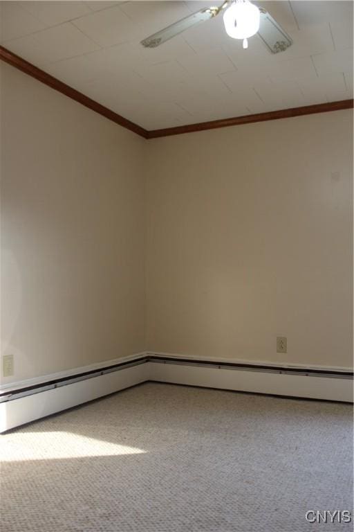 carpeted spare room with ceiling fan and a baseboard heating unit