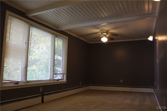 carpeted spare room featuring ceiling fan, plenty of natural light, beamed ceiling, and crown molding