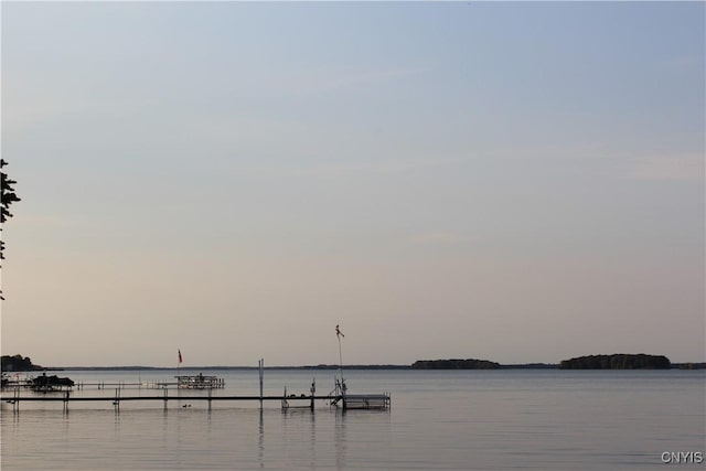 property view of water featuring a boat dock