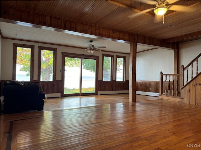 unfurnished living room featuring a baseboard radiator, light hardwood / wood-style flooring, and ceiling fan