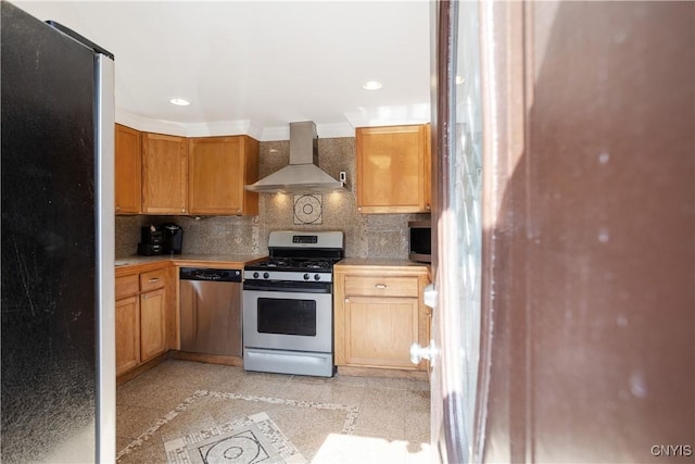 kitchen featuring appliances with stainless steel finishes, tasteful backsplash, and wall chimney exhaust hood