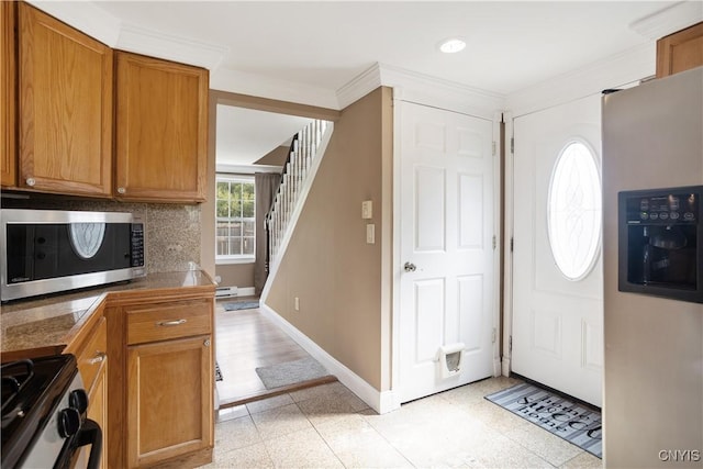 entrance foyer featuring ornamental molding