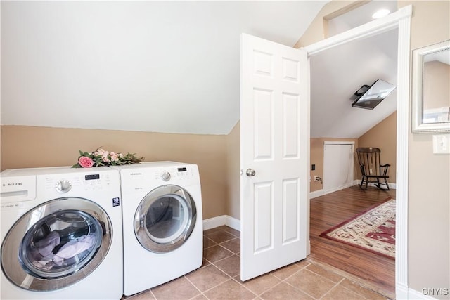 washroom featuring light tile patterned floors and washing machine and clothes dryer