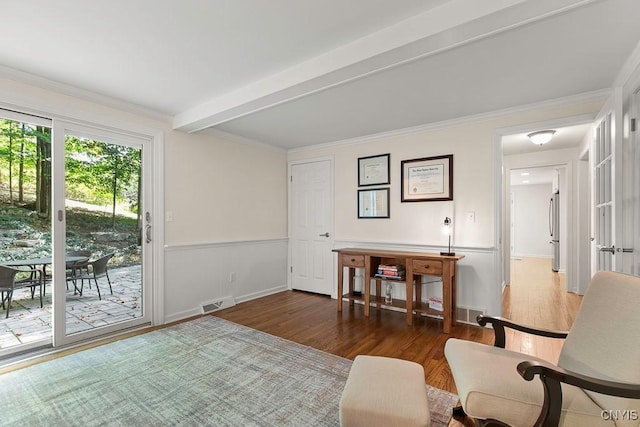 living area featuring beamed ceiling, dark hardwood / wood-style flooring, and crown molding