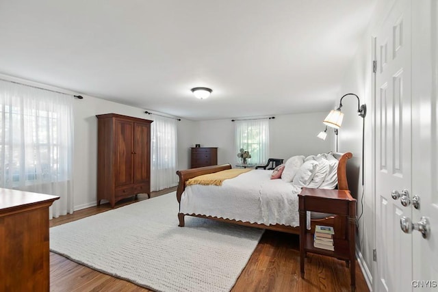 bedroom featuring dark hardwood / wood-style flooring