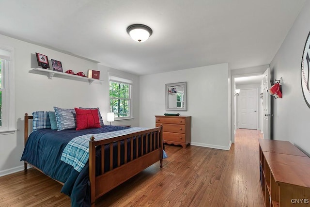 bedroom with wood-type flooring