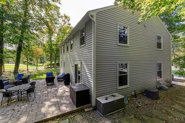 view of side of home featuring a patio