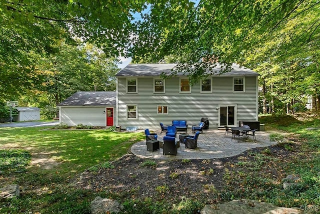 rear view of property with a patio area, a yard, and an outdoor hangout area