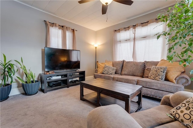 carpeted living room featuring ceiling fan