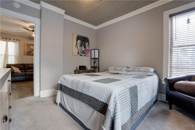 carpeted bedroom featuring multiple windows and crown molding