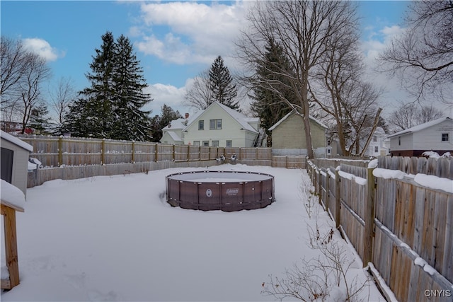 view of yard layered in snow