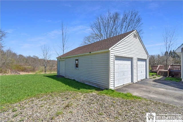 garage featuring a yard