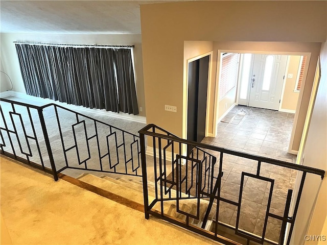 staircase with tile patterned flooring