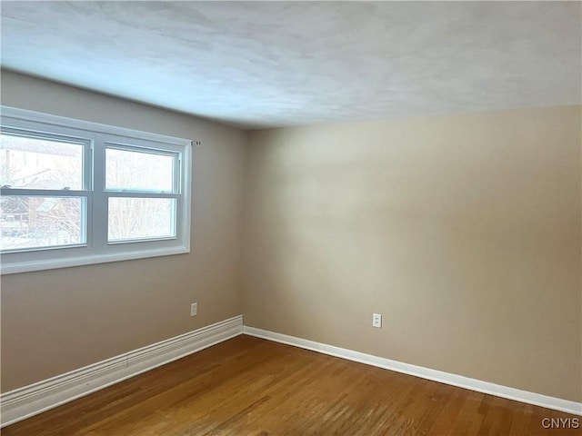 spare room featuring hardwood / wood-style floors