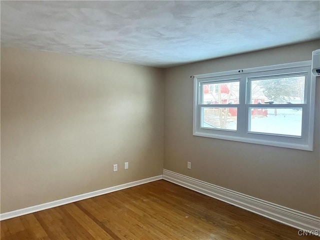 empty room featuring hardwood / wood-style flooring