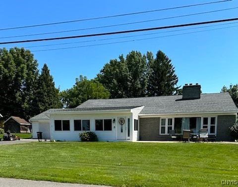 ranch-style home with a front lawn