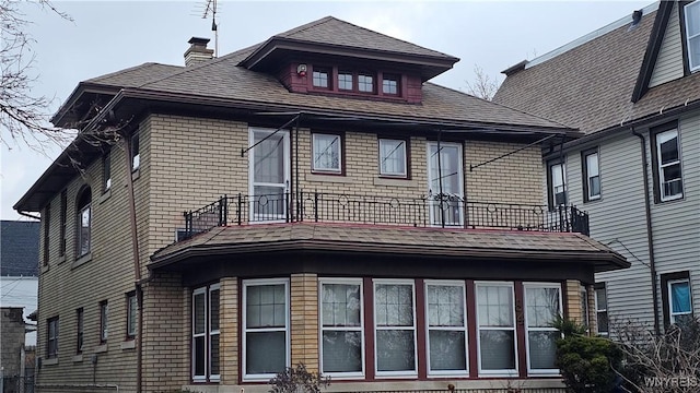 back of house with a balcony