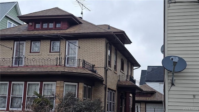 view of home's exterior featuring a balcony