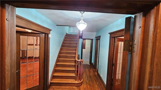 staircase featuring hardwood / wood-style flooring