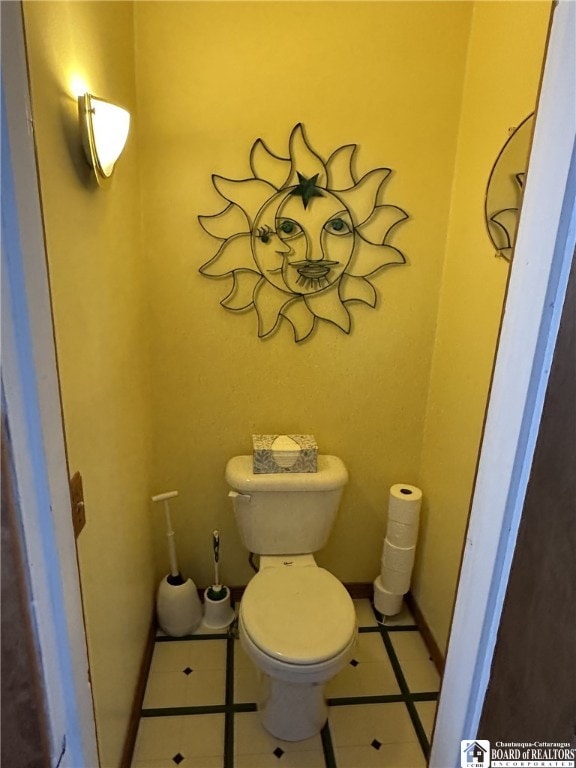 bathroom with tile patterned flooring and toilet