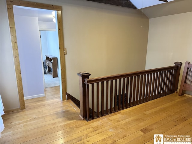 stairway featuring hardwood / wood-style floors