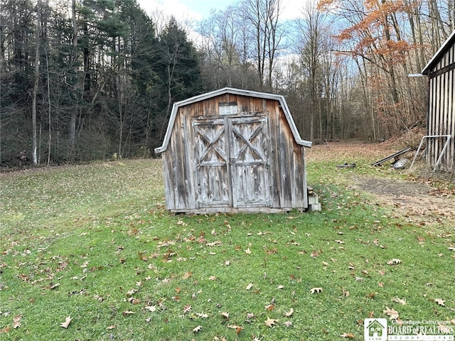 view of outdoor structure with a lawn