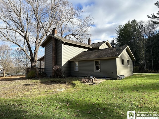 view of home's exterior with a lawn