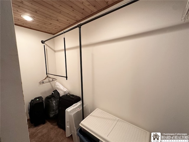 laundry room with wood ceiling and carpet floors