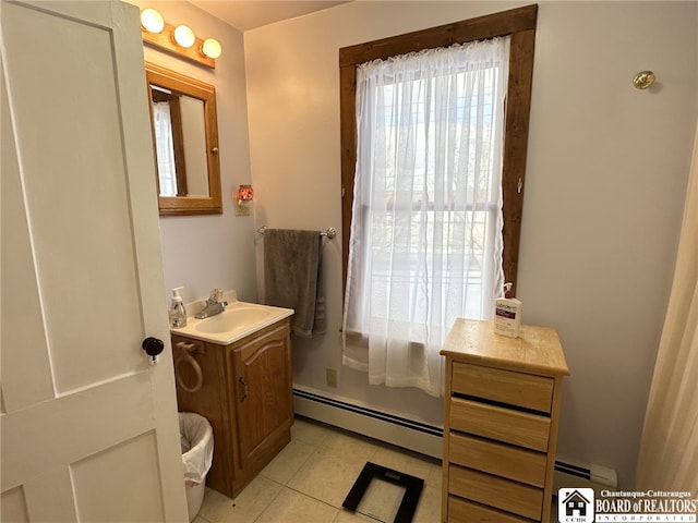 bathroom with baseboard heating, tile patterned flooring, and vanity