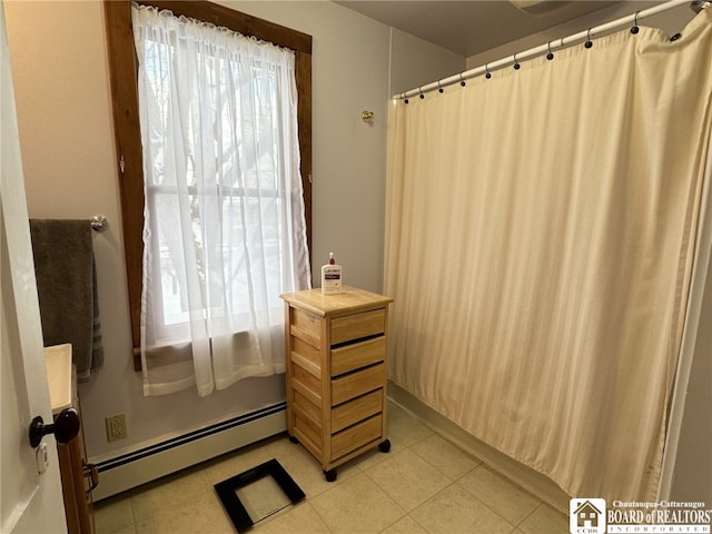 bathroom featuring a baseboard heating unit