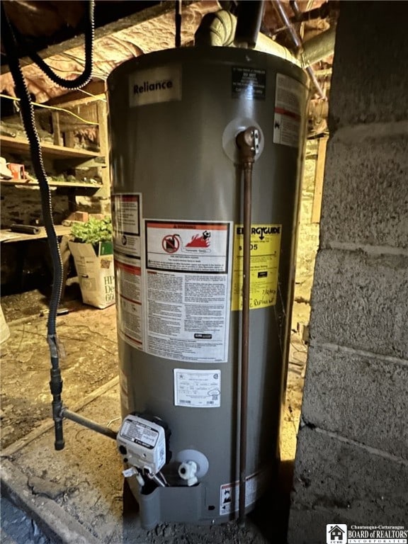 utility room featuring gas water heater