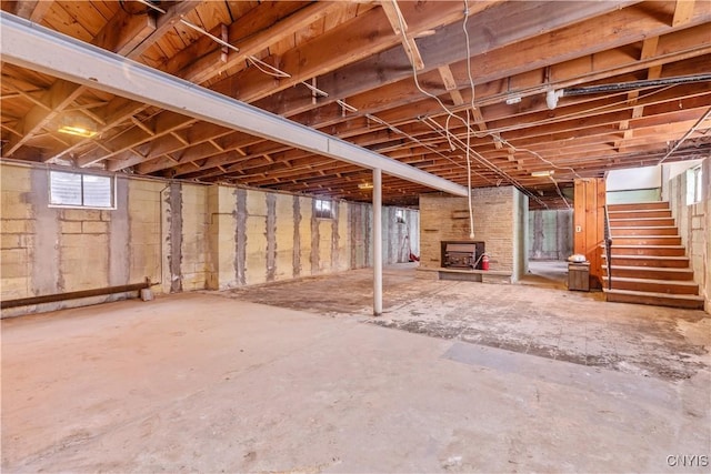 basement featuring a wood stove