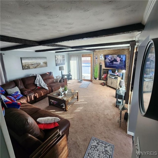 carpeted living room with beam ceiling