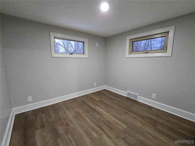 empty room featuring dark hardwood / wood-style floors