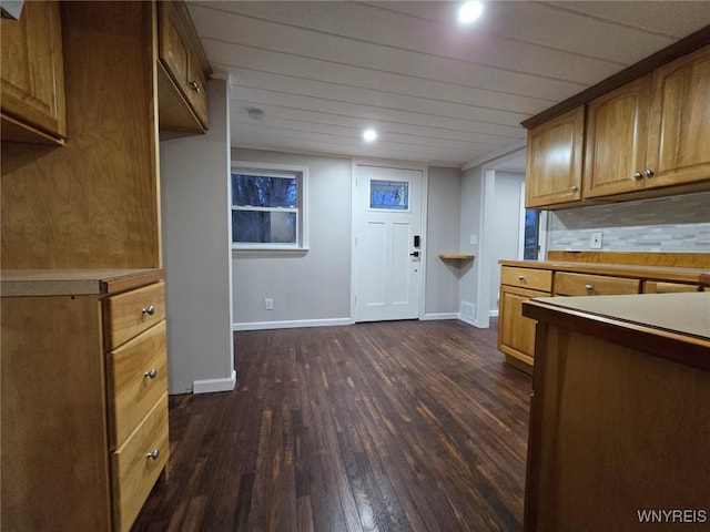 kitchen featuring dark hardwood / wood-style flooring and tasteful backsplash