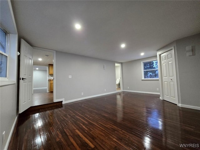 spare room with dark hardwood / wood-style floors