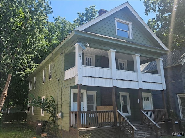 view of front of home with covered porch and a balcony