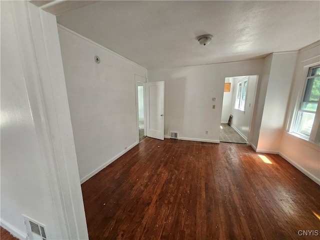 spare room featuring dark hardwood / wood-style floors